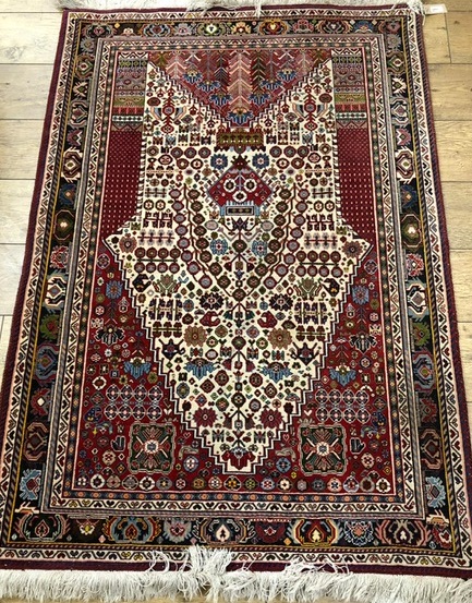A Turkish red ground prayer rug and two other rugs, 154cm x 108cm, 159cm x 113cm and 149 x 100cm